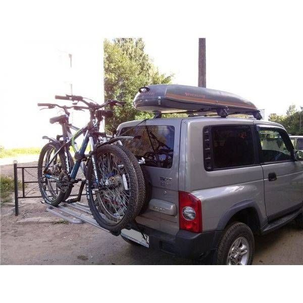 Suport biciclete Menabo Boa 3 pentru 3 biciclete cu prindere pe roata de rezerva